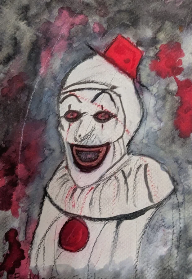 Un clown à la bouche noire et au petit chapeau rouge surgit d’éclaboussures grises.